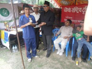 Abilis facilater Mr. Birendra raj Pokheral awarding Lumbini's B2 Player Ram Prasad Poudel Man of the match trophy