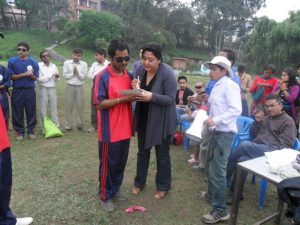 Valley's B1 Player Bhawitsya Jha Receiving Man of the Match from Punam Karmacharya