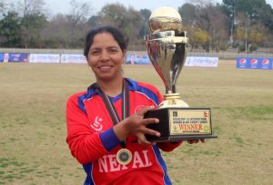Captain Ms. Bhagwati Bhattarai of Nepali Blind Women Cricket team holding the winning trophy.
